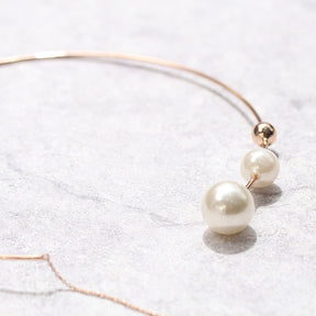 Collier ras du cou asymétrique en perles 
